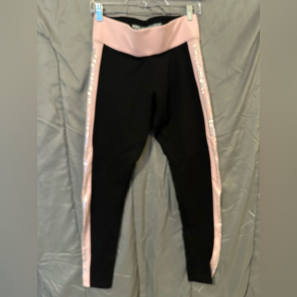 Pink brand rhinestone legging. Detail on both sides of legs.